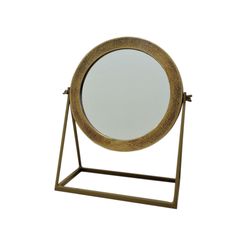 a round mirror sitting on top of a metal stand