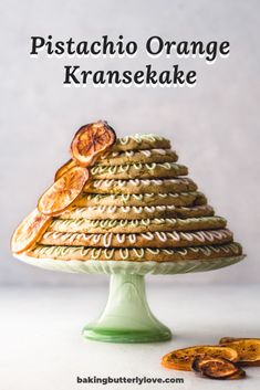 a stack of cookies sitting on top of a green cake plate with the words, pistachio orange kraske