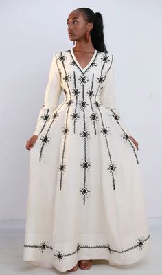 Ethiopia tradition dress in style, black cross embroidered with fert detail. Ston decorated habesha dress Ethiopia Clothing, Modern Habesha Dress, Ethiopian Fashion, Habesha Dress, Ethiopian Traditional Dress, Ethiopian Dress, Habesha Kemis, African Traditional Dresses, Cultural Celebration