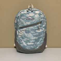 High Sierra Outburst 2.0 Clouds Backpack -Approximate Measurements/Dimensions: 17.6" X 12.4" X 5.4" -Clouds -360 Reflectivity -Interior Padded Laptop/Tablet Sleeve Sized To Fit Most Standard Laptops Up To 15.6" -Spacious Main Compartment Gives You Room To Breathe And Pack What You Need -Front Pocket With Organization Keeps All Essentials Together And Easily Accessible -Zippered Front Stash Pocket Offers Quick, Secure Storage -Straps And Back Panel Feature Airmesh + Foam For A Comfort That’s Neve High Sierra Backpack, Tablet Sleeve, Tablet Laptop, Front Pocket, Blue Grey, Tablet, Bag Lady, Laptop, Backpacks