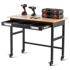 a workbench with two drawers and tools on it