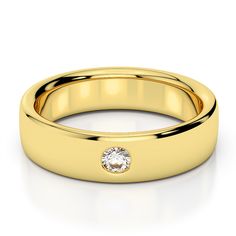 a yellow gold wedding band with a diamond