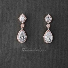 two pairs of earrings with diamonds on them