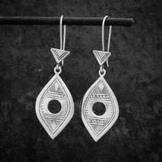 These stunning unique earrings are handmade in sterling silver and inspired by a traditional Tuareg design from North Africa. A contemporary take on a traditional tribal design.  Dimensions (approx):  * Length: 6cm including hook * Width: 2cm  Materials: * Sterling Silver Beyond Biasa creates unique jewellery that is inspired by antique and tribal designs from around the globe. All of our pieces are handmade so please allow for slight variations in size and colour. Traditional Festival Earrings With Ear Wire, Traditional Ear Wire Earrings For Festivals, Traditional Silver Earrings With Ear Wire, Traditional Drop Earrings Nickel Free, Traditional Silver Plug Earrings With Ear Wire, Traditional Festival Plug Earrings With Ear Wire, Traditional Sterling Silver Dangle Earrings, Ceremonial Sterling Silver Drop Earrings, Sterling Silver Drop Earrings For Ceremonial Occasions