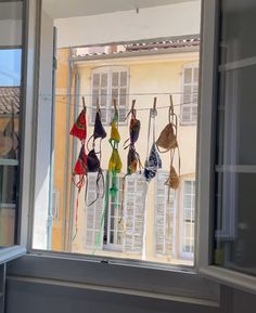 there are many bras hanging in the window