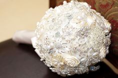 a bridal bouquet sitting on top of a table