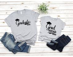 "Graduation T-Shirts, Graduation 2021, Family of graduated, Graduation Squad shirts, College Grad shirt, Graduation Squad, Proud Mom of Grad d1 𝐀𝐃𝐃 𝐓𝐄𝐗𝐓 𝐎𝐍 𝐓𝐇𝐄 𝐁𝐀𝐂𝐊 Custom orders are always welcome. We can customize all of our designs to your needs! Please feel free to contact us if you have any questions. ♥ 𝐇𝐎𝐖 𝐓𝐎 𝐎𝐑𝐃𝐄𝐑 ♥ 1. Pick the right \"𝐓𝐲𝐩𝐞 & 𝐒𝐢𝐳𝐞\" 2. Click \"𝐀𝐃𝐃 𝐓𝐎 𝐂𝐀𝐑𝐓\". For multiple items please add them to your shopping cart one by one. 𝐘? Cotton Short Sleeve T-shirt For Graduation Party, Casual Crew Neck T-shirt For Graduation Party, Casual Tops With Custom Print For Graduation, Black Crew Neck Top For Graduation Party, Customizable Casual Tops For Graduation, Casual Letter Print Tops For Graduation Party, Graduation Party Letter Print Short Sleeve Tops, Customizable Casual T-shirt For Graduation Gift, Graduation Party Tops With Letter Print And Short Sleeves