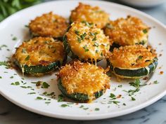 zucchini stuffed with parmesan cheese on a white plate