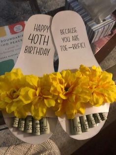 two flip flops decorated with yellow flowers and the words happy 10th birthday written on them