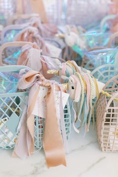 pastel ribbons and bows are tied in baskets