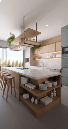 a modern kitchen with an island counter and wooden stools