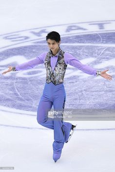 a woman is skating on an ice rink