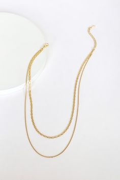 Sometimes most minimal pieces make the biggest impact! The Lulus Simple Elegance Gold Layered Necklace is ultra-trendy with its mariner-link chain and plain gold chain that layer together beautifully. Lobster clasp closure. Shortest necklace measures 14" long with a 2. 5" extender chain. Man made materials. Imported. Lulus | Simple Elegance Gold Layered Necklace. Gold Multi-strand Layered Necklace With Figaro Chain, Gold Multi-strand Figaro Chain Necklace, Trendy Gold Layered Necklace With Figaro Chain, Minimalist Multi-strand Gold Layered Necklace, Minimalist Gold Multi-strand Layered Necklace, Minimalist Gold Layered Necklace With Figaro Chain, Delicate Metal Link Layered Necklace, Minimalist Multi-strand Gold Chain Layered Necklace, Gold Layered Figaro Chain Necklace For Everyday