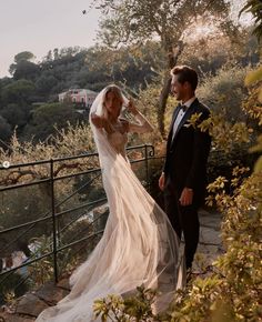 the bride and groom are posing for pictures