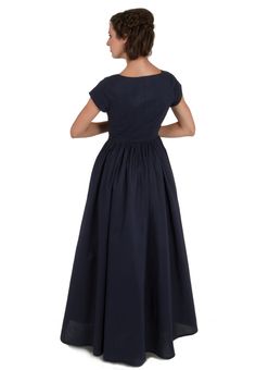 "This charming Victorian style crisp cotton dress is made up in your choice of solid colors. The fitted bodice has a scooped neckline, short capped sleeves, covered buttons down the front, and a figure-flattering deep \"V\" where the bodice joins the full three-gored skirt. Sure to be your new favorite dress. Also the perfect dress for a bridesmaid in Victorian, pioneer, or old west themed wedding. The model is also wearing a crinoline, and boots, and she carries gloves. These accessories are pr Gored Skirt, Old West, Themed Wedding, Victorian Style, Favorite Dress, Fitted Bodice, Stunning Dresses, Covered Buttons, Victorian Fashion