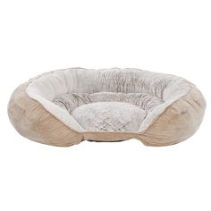 a dog bed that is made out of fabric and has a round shape on the front