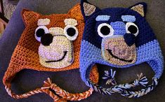 two crocheted hats with faces on them