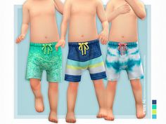 three young boys wearing swim trunks and shorts