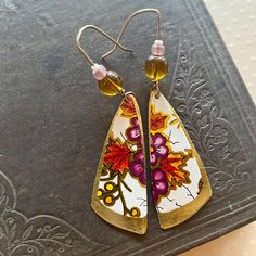 🌼 Elevate your style with artfully crafted earrings from Tin Forest! Our unique Artisan Earrings are a perfect blend of Boho Charm and eco-friendly fashion. Meticulously crafted using Upcycled and Vintage Materials, each pair has a distinct Hippy Vibe, adding a touch of free-spirited style to any ensemble. Our earrings are lightweight, easy to wear and have silicone backs to help keep them secure. Each pair of earrings is handmade from vintage and recycled tin and metal. Small scratches and imperfections from its past life may be visible, so please inspect all photos carefully.  🌼 We offer Free USPS Ground Advantage shipping on all orders with an estimated 1-6 day delivery. 🌼 DISCOUNTS - enter code at checkout. Save 20% on 2 items with promo code "TAKE20OFF2" Save 30% on 3 items with pr Upcycled Tin Jewelry, Tin Jewelry, Crafted Earrings, Recycled Tin, Nevada City, Free Spirit Style, Artisan Earrings, Eco Friendly Fashion, Free Spirited