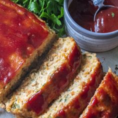 slices of meatloaf bread with ketchup and lettuce on the side