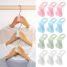 clothes hangers with clips attached to them on a wooden rack and in front of a white t - shirt