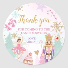 a round sticker with an image of two fairy characters and a cupcake on it