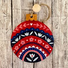 an ornament hanging on a wooden wall