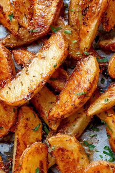 cooked potatoes with herbs and seasoning on top