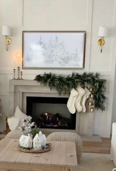 a living room decorated for christmas with stockings on the fireplace mantel and stockings hanging from the mantle