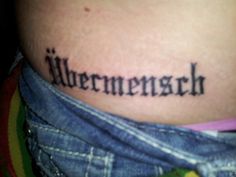 a woman with a tattoo on her stomach that reads, allergenseh