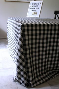 a table with a black and white checkered cloth on it