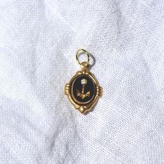 This charm is made of an 10x8mm carved glass cab that was produced in Germany in the 1970s. The charm has been hand set by me in a raw brass setting. The overall size of the charm including the setting is 18mm tall (including loop) and 12mm wide. The charm comes with a jump ring for threading on your favorite necklace Brass Oval Pendant Jewelry With Charms, Oval Pendant Charms Jewelry In Brass, Handmade Vintage Brass Charms, Vintage Handmade Brass Charms, Handmade Vintage Charms For Jewelry Making, Victorian Vintage Charm In Yellow Gold, Victorian Yellow Gold Vintage Charm, Collectible Oval Pendant Charms Jewelry, Vintage Cameo Jewelry In Enamel