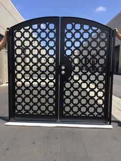 an iron gate with circular designs on it