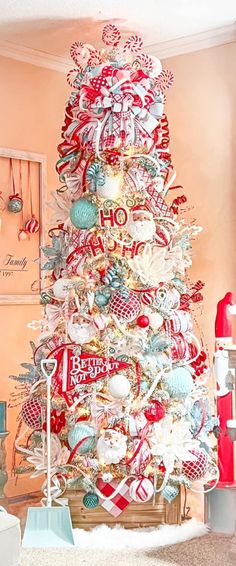 a christmas tree decorated with red, white and blue ornaments