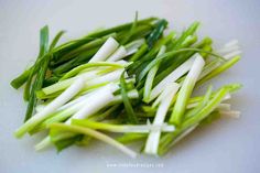 some green and white vegetables are on a cutting board