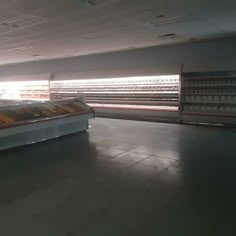 an empty grocery store filled with lots of food