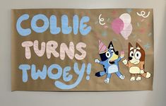 there is a sign on the wall that says collie turns twoy