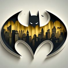 the batman symbol is cut out from paper and placed on top of a cityscape