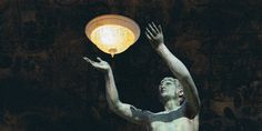 a statue holding a lamp in his hand and reaching up to catch it with both hands