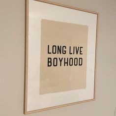 a long live boyhood poster hanging on the wall