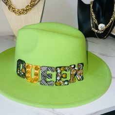 This Item Is Brand New And Made As A Custom Piece From My Accessories Boutique. You Won’t Find Another Like It. Colors Of Hat Are Two Tones, Green Top, Pink Bottom(Bright). Colors In Queen Are Gold, Black, White, Gray And White. This Item(S) Comes From A Smoke Free Home. This Is Fashion! We Believe That Any Imperfection Including Wear, Stains, Fading And Repairs Add To The Uniqueness Of Each Piece Sold Here. Thank You Shopping. Trendy Green Fitted Hat, Custom Fedora Hat, Custom Fedora, Women Hats Fashion, Hats Fashion, Women Hats, Accessories Boutique, Pink Bottom, Boutique Accessories