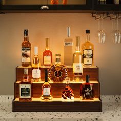 an assortment of liquor bottles on display in a bar