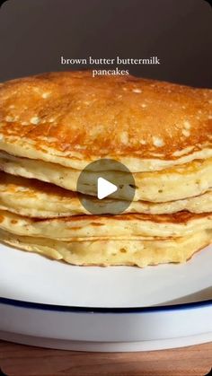 a stack of pancakes sitting on top of a white plate