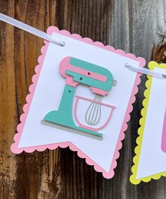 a paper banner with an image of a mixer and a whisk on it