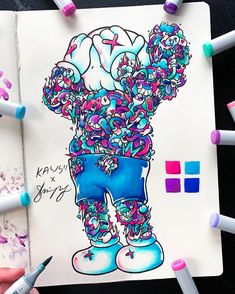 a drawing of a cartoon character with lots of colored crayons around it and some markers