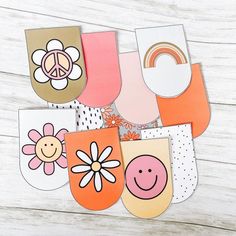 several cards with different designs on them and one has a flower in the middle, two are