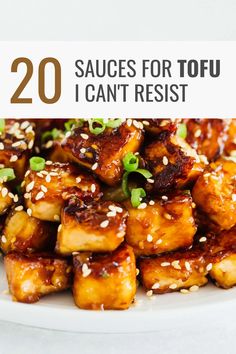 tofu on a plate with sesame seeds and green onions