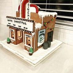 a gingerbread house decorated with icing and decorations