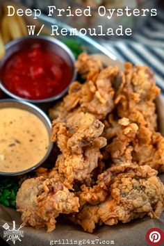 deep fried oysters w / remoulade on a plate with dipping sauce