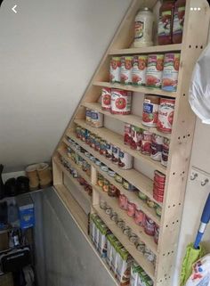 the shelves are filled with canned food